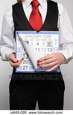 Businesswoman holding calendar View Large Photo Image Stock Photograph - Businesswoman holding calendar. Fotosearch
