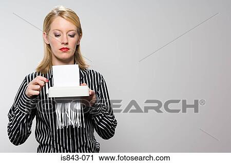 Businesswoman shredding paper View Large Photo Image Stock Image - Businesswoman shredding paper. Fotosearch