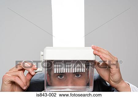 Man shredding paper View Large Photo Image Stock Image - Man shredding paper. Fotosearch