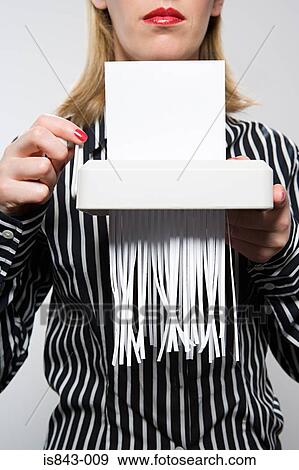 Woman shredding paper View Large Photo Image Stock Photo - Woman shredding paper. Fotosearch