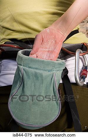 Female climber reaching into chalk pouch View Large Photo Image Stock Photography - Female climber reaching into chalk pouch. Fotosearch
