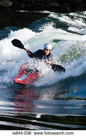 Stock Photo - Man kayaking on river. Fotosearch