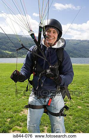 Smiling male parachutist View Large Photo Image Stock Photograph - Smiling male parachutist. Fotosearch