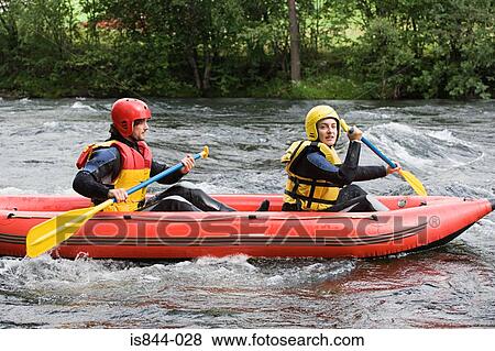 Two people white water rafting View Large Photo Image Stock Photo - Two people white water rafting. Fotosearch