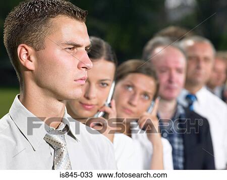 Businessman in a queue View Large Photo Image Stock Image - Businessman in a queue. Fotosearch