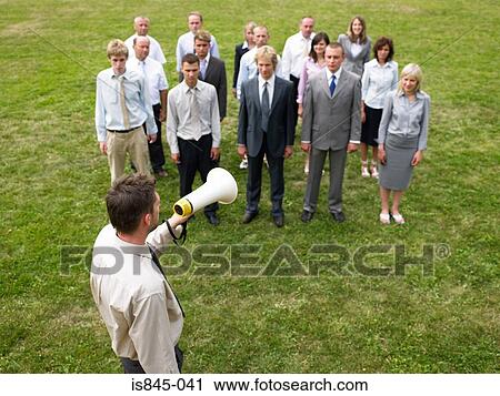 Businessman talking to colleagues View Large Photo Image Stock Image - Businessman talking to colleagues. Fotosearch