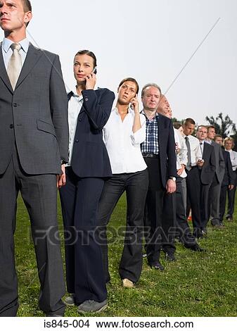 Businesspeople in a queue View Large Photo Image Picture - Businesspeople in a queue. Fotosearch