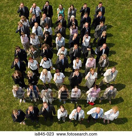 Businesspeople using cell phones View Large Photo Image Stock Image - Businesspeople using cell phones. Fotosearch
