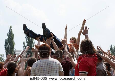 Crowd carrying woman View Large Photo Image Stock Photography - Crowd carrying woman. Fotosearch