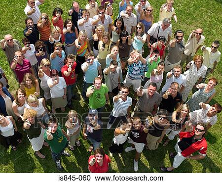 Stock Image - Crowd using cell phones. Fotosearch