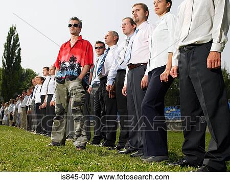 Man standing out from the crowd View Large Photo Image Stock Photo - Man standing out from the crowd. Fotosearch