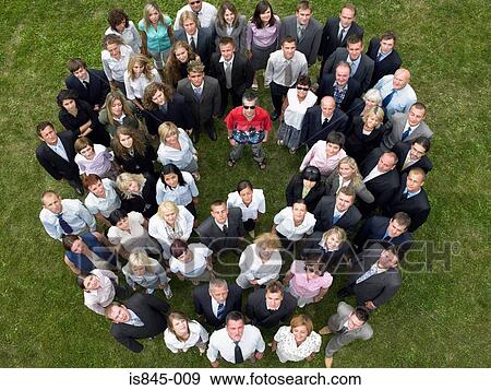 Stock Photo - Man standing out from the crowd. Fotosearch