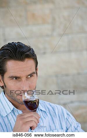 Stock Photograph - Man tasting wine. Fotosearch