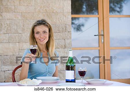 Woman holding glass of wine View Large Photo Image Stock Photograph - Woman holding glass of wine. Fotosearch