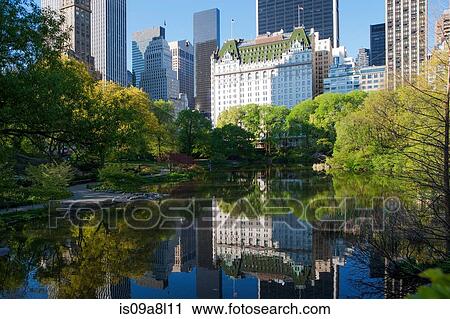 Buildings on lake in Central Park, New York City, USA View Large Photo Image Stock Image - Buildings on lake in Central Park, New York City, USA. Fotosearch
