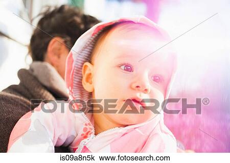 Close up portrait of baby girl wearing hood View Large Photo Image Stock Image - Close up portrait of baby girl wearing hood. Fotosearch