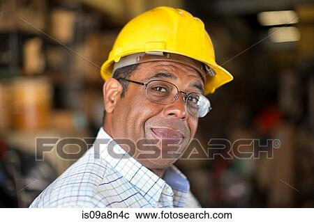 Close up portrait of man in stockroom View Large Photo Image Stock Image - Close up portrait of man in stockroom. Fotosearch
