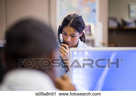 Colleagues working in busy office View Large Photo Image Stock Image - Colleagues working in busy office. Fotosearch