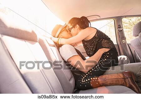 Stock Photo - Couple in car, kissing. Fotosearch