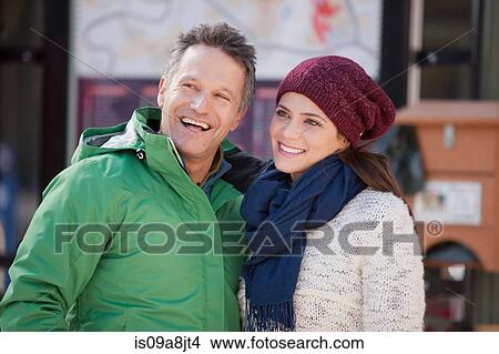 Couple in warm clothing smiling View Large Photo Image Picture - Couple in warm clothing smiling. Fotosearch