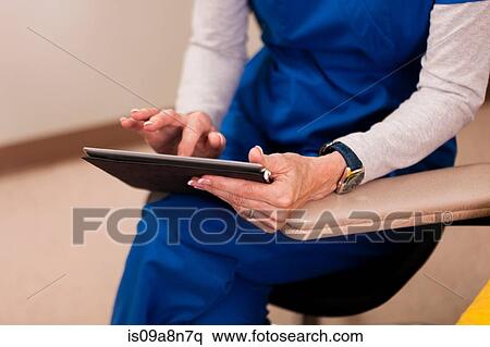 Doctor using digital table, close up View Large Photo Image Stock Photography - Doctor using digital table, close up. Fotosearch