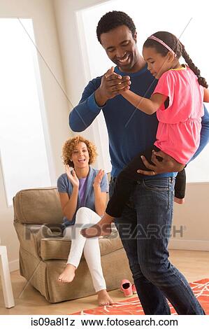 Stock Photo - Father and daughter dancing. Fotosearch