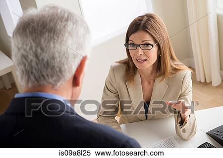 Man and woman talking in meeting View Large Photo Image Stock Photography - Man and woman talking in meeting. Fotosearch