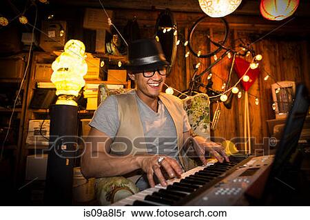 Stock Photography - Man playing keyboard. Fotosearch