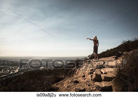 Man pointing at view over San Diego, California, USA View Large Photo Image Stock Photograph - Man pointing at view over San Diego, California, USA. Fotosearch