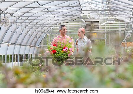 Mature man and mid adult woman shopping in garden centre View Large Photo Image Stock Photography - Mature man and mid adult woman shopping in garden centre. Fotosearch