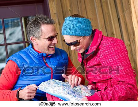 Mature man and young woman looking at map in ski resort View Large Photo Image Stock Photography - Mature man and young woman looking at map in ski resort. Fotosearch