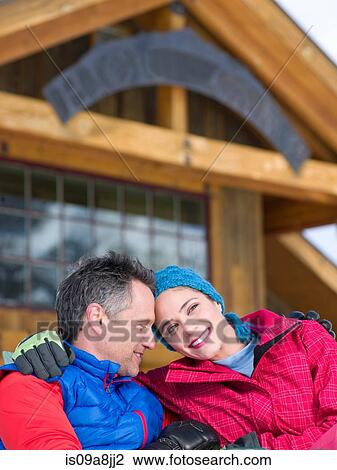 Mature man and young woman relaxing together in ski resort View Large Photo Image Stock Image - Mature man and young woman relaxing together in ski resort. Fotosearch