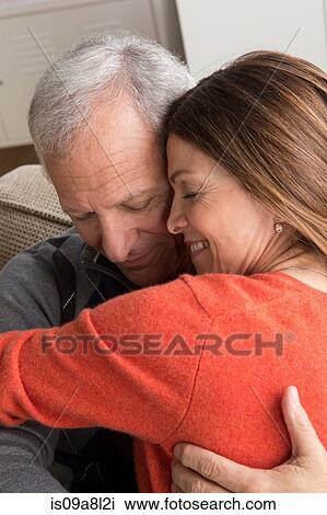Mature woman and senior man hugging View Large Photo Image Stock Image - Mature woman and senior man hugging. Fotosearch