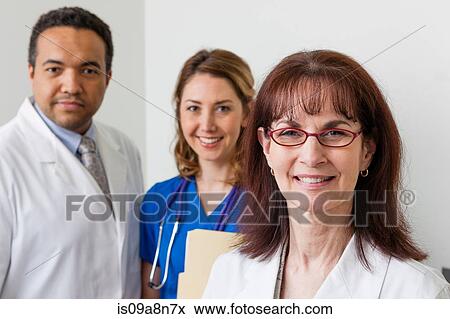 Medical professionals together in hospital, portrait View Large Photo Image Stock Photo - Medical professionals together in hospital, portrait. Fotosearch