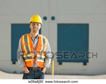 Mid adult construction worker with hand sin pockets, portrait View Large Photo Image Stock Image - Mid adult construction worker with hand sin pockets, portrait. Fotosearch