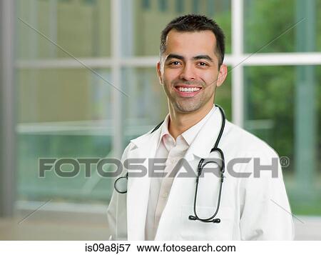 Mid adult doctor with stethoscope smiling, portrait View Large Photo Image Stock Photo - Mid adult doctor with stethoscope smiling, portrait. Fotosearch