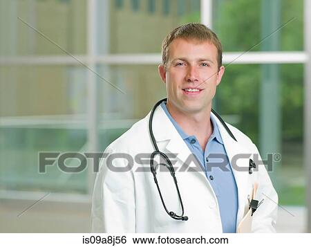 Mid adult doctor with stethoscope smiling, portrait View Large Photo Image Stock Photograph - Mid adult doctor with stethoscope smiling, portrait. Fotosearch