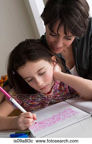 Mother watching daughter writing View Large Photo Image Stock Image - Mother watching daughter writing. Fotosearch