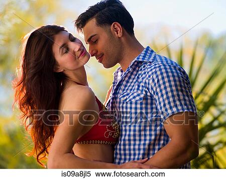 Stock Photography - Passionate young couple embracing. Fotosearch
