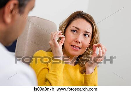Patient explaining symptom to doctor in hospital View Large Photo Image Stock Image - Patient explaining symptom to doctor in hospital. Fotosearch