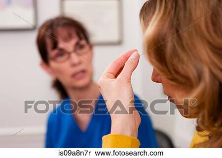 Patient explaining symptom to doctor in hospital View Large Photo Image Stock Photography - Patient explaining symptom to doctor in hospital. Fotosearch