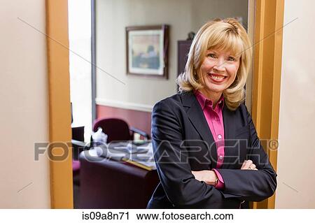 Portrait of mature female outside home office View Large Photo Image Stock Image - Portrait of mature female outside home office. Fotosearch