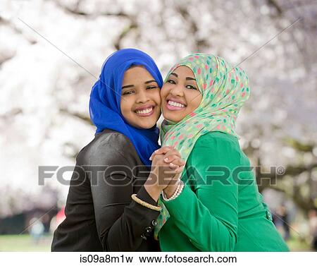 Portrait of two young females in park dancing together View Large Photo Image Stock Photo - Portrait of two young females in park dancing together. Fotosearch