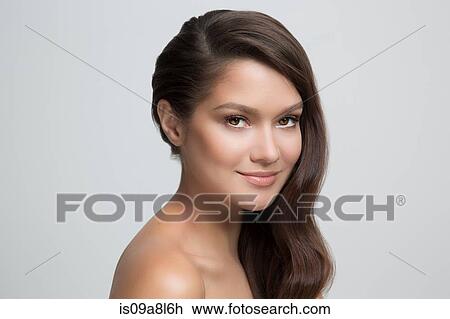 Portrait of woman with brown hair, smiling View Large Photo Image Stock Image - Portrait of woman with brown hair, smiling. Fotosearch