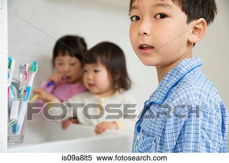 Portrait of young boy and sisters in bathroom View Large Photo Image Stock Photography - Portrait of young boy and sisters in bathroom. Fotosearch