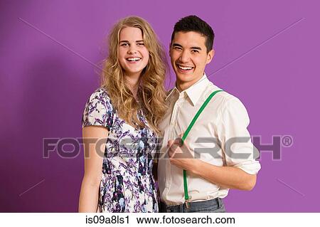 Portrait of young couple smiling View Large Photo Image Stock Image - Portrait of young couple smiling. Fotosearch