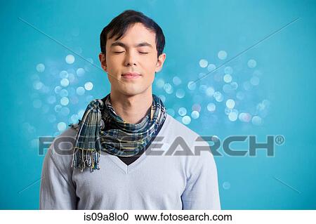 Portrait of young man wearing blue jumper and scarf View Large Photo Image Stock Image - Portrait of young man wearing blue jumper and scarf. Fotosearch