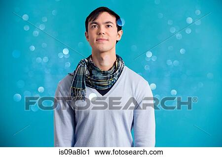 Portrait of young man wearing blue jumper and scarf View Large Photo Image Stock Image - Portrait of young man wearing blue jumper and scarf. Fotosearch