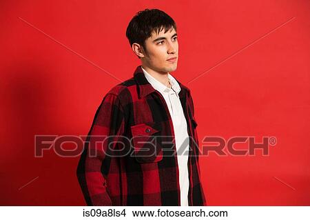 Portrait of young man wearing checked shirt View Large Photo Image Picture - Portrait of young man wearing checked shirt. Fotosearch