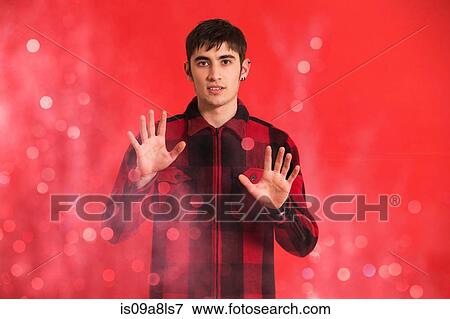 Portrait of young man wearing checked shirt View Large Photo Image Stock Photo - Portrait of young man wearing checked shirt. Fotosearch